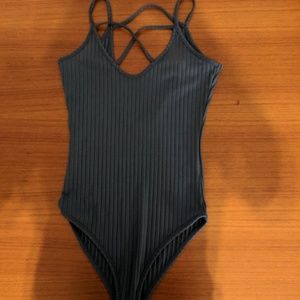 Blue strappy bodysuit.